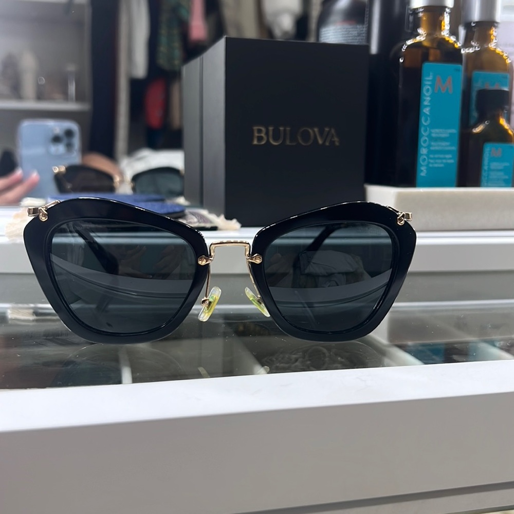 MIU MIU MU 10NS NOIR 1AB1A1 Black and Gold